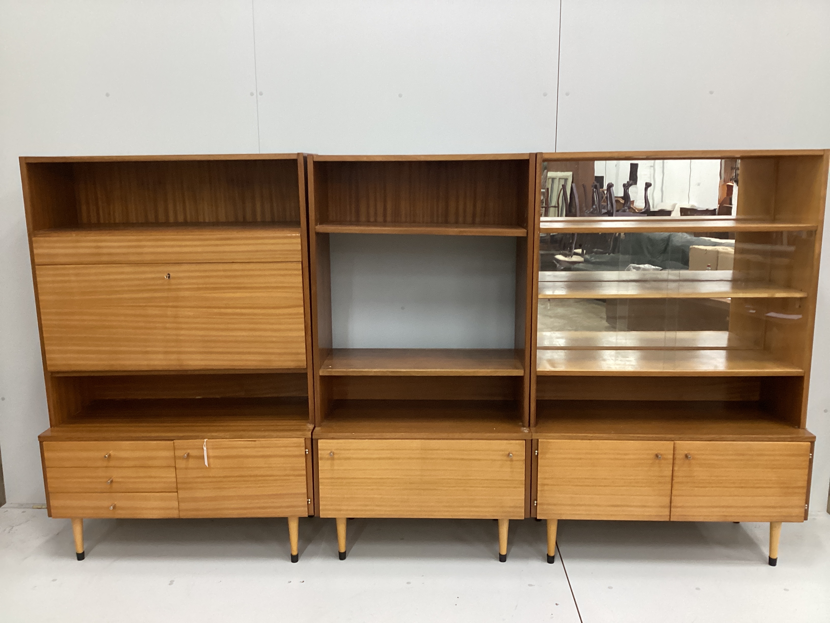 Three mid century teak modular wall units, combined length 280cm, depth 46cm, height 153cm